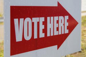 Sign that says "VOTE HERE"