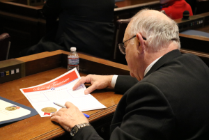 Elector Mike Callahan who represents Tennessee’s 6th Congressional District signs a voting certificate in the House Chamber Monday, Dec. 19, 2016.